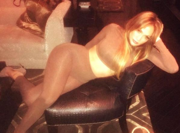 Jennifer Lopez lounges in a skintight two-piece.