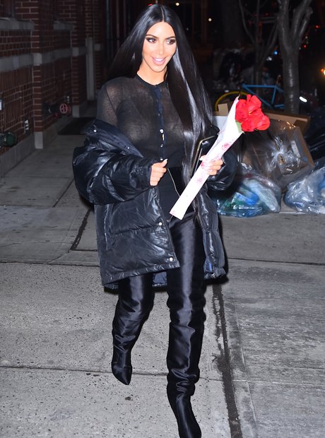Kim Kardashian holding a bunch of roses