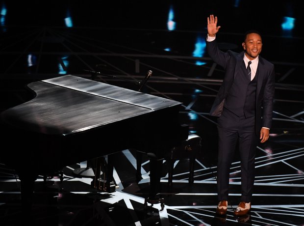 John Legend performs on stage at the Oscars 2017