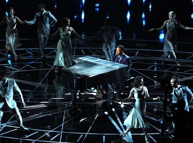 John Legend performs on stage at the Oscars 2017