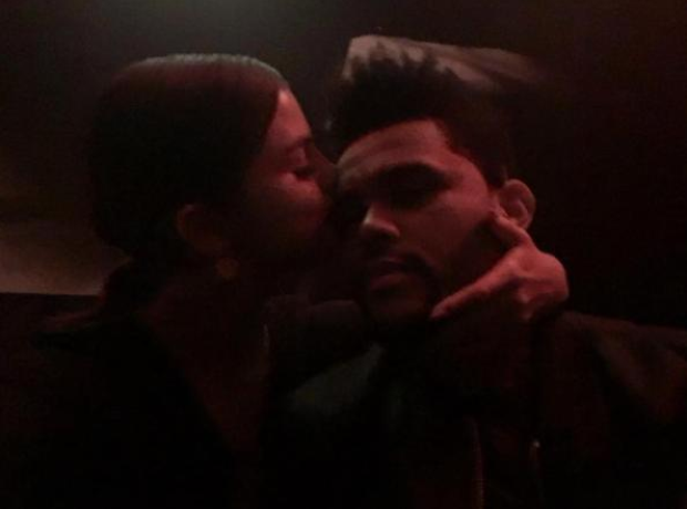 Selena Gomez kissing The Weeknd