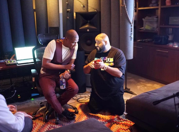 DJ Khaled knelt down to show Jay Z something on his phone in the studio. -  16... - Capital XTRA