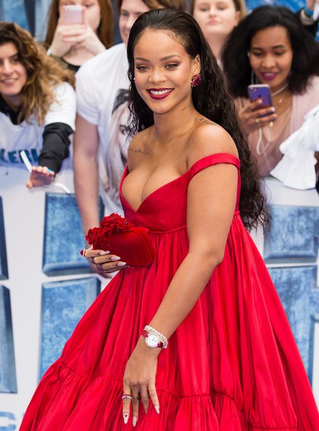Rihanna opts for a busty dress as she attends the 