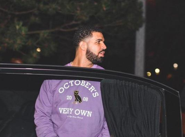 Drake wearing his own OVO sweater