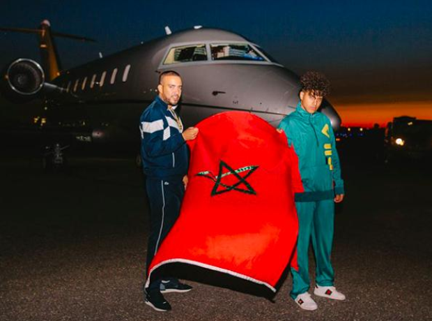 French Montana holding up a Moroccan flag