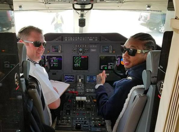 Tyga flying a plane