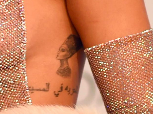 The Egyptian Queen Nefertiti on her ribcage. - A Guide To Rihanna's Tattoos:...  - Capital XTRA