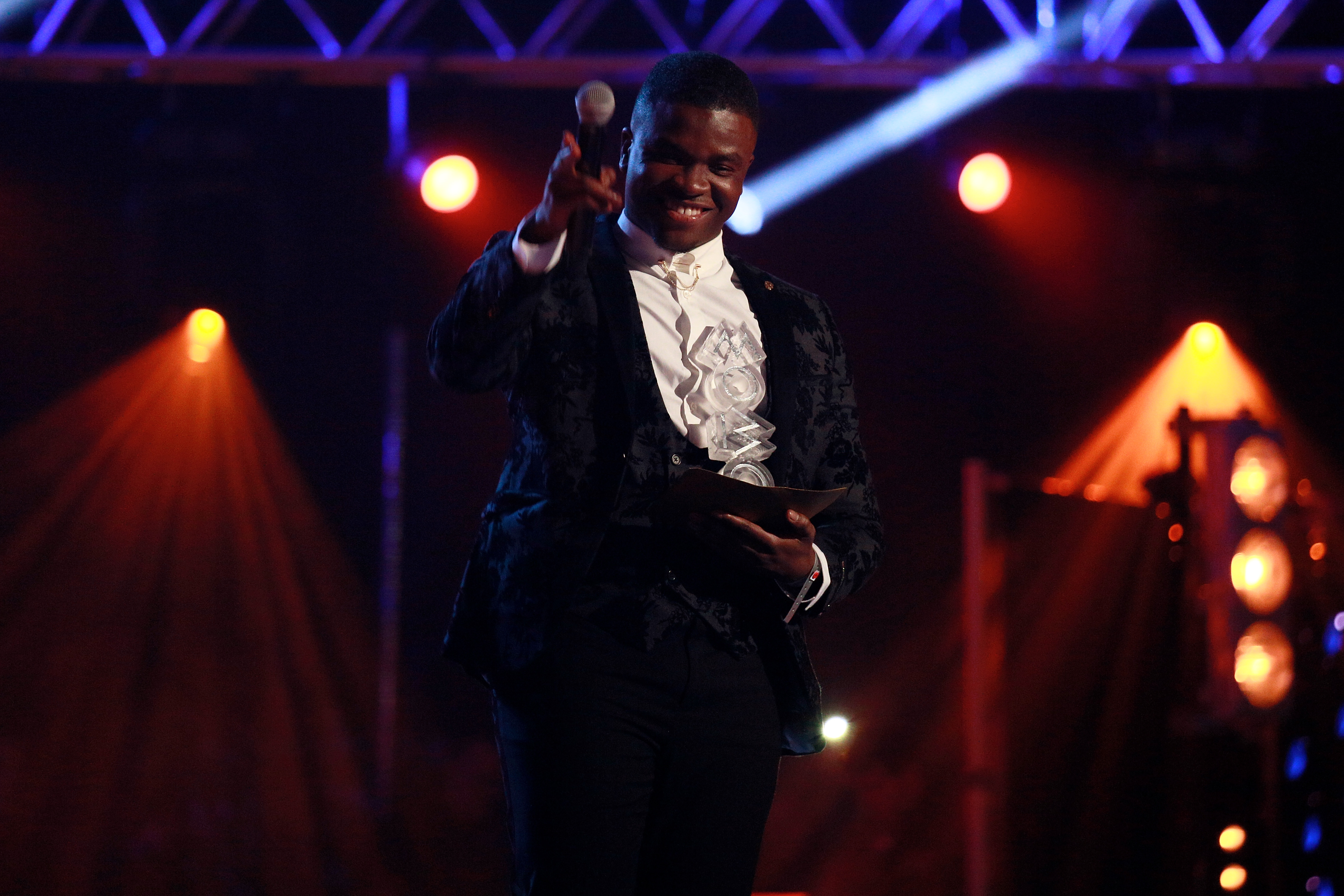 Michael Dapaah speaks on stage at the MOBO Awards